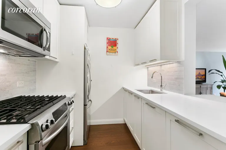 New York City Real Estate | View 200 East 94th Street, 507 | Kitchen opens into Living/Dining Room | View 3