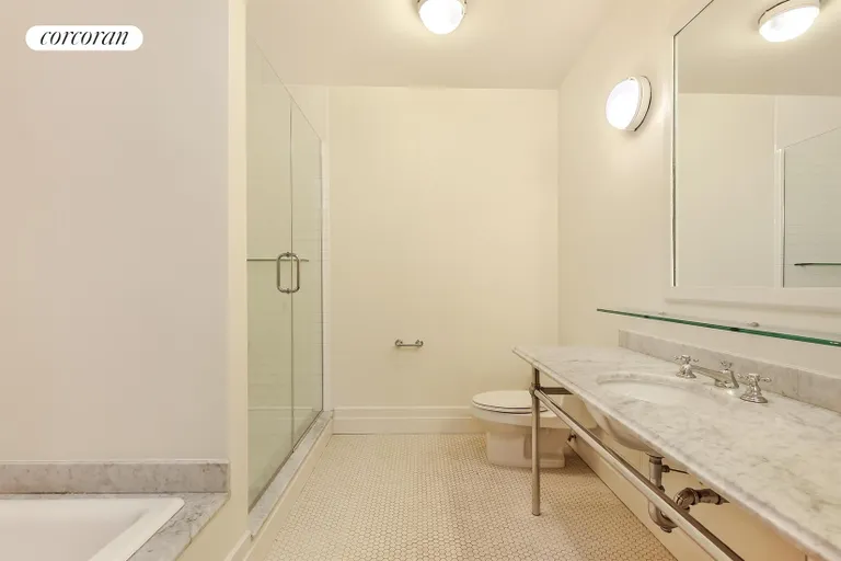 New York City Real Estate | View 1 Main Street, 3F | Master Bathroom w/ tub and glass enclosed shower | View 5