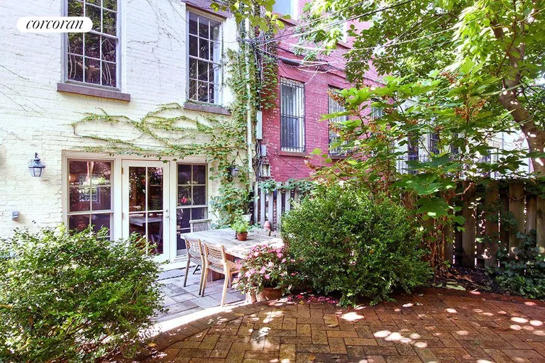 New York City Real Estate | View 67 Joralemon Street | Rear garden and outdoor dining area | View 12