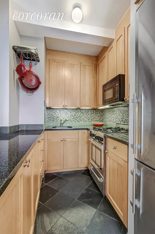 New York City Real Estate | View 220 Madison Avenue, 8C | Luxurious kitchen with stainless steel appliances | View 2