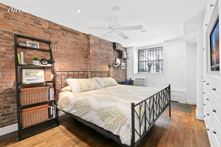 New York City Real Estate | View 15 Jones Street, 1E | Master Bedroom with Exposed Brick | View 5