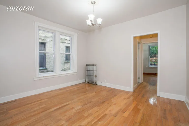 New York City Real Estate | View 489 Montgomery Street, 1-R | Nice sized living room with two windows | View 3
