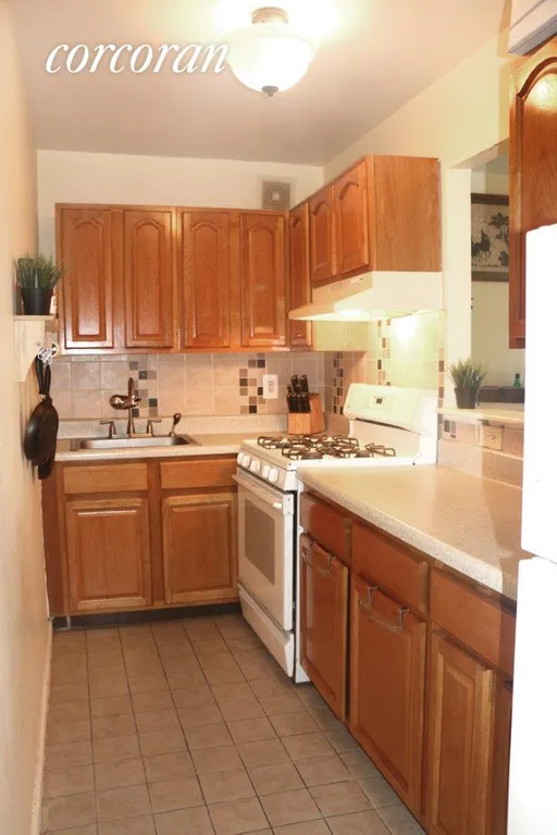 New York City Real Estate | View 499 Greene Avenue, 1 | Kitchen with pass through window | View 5