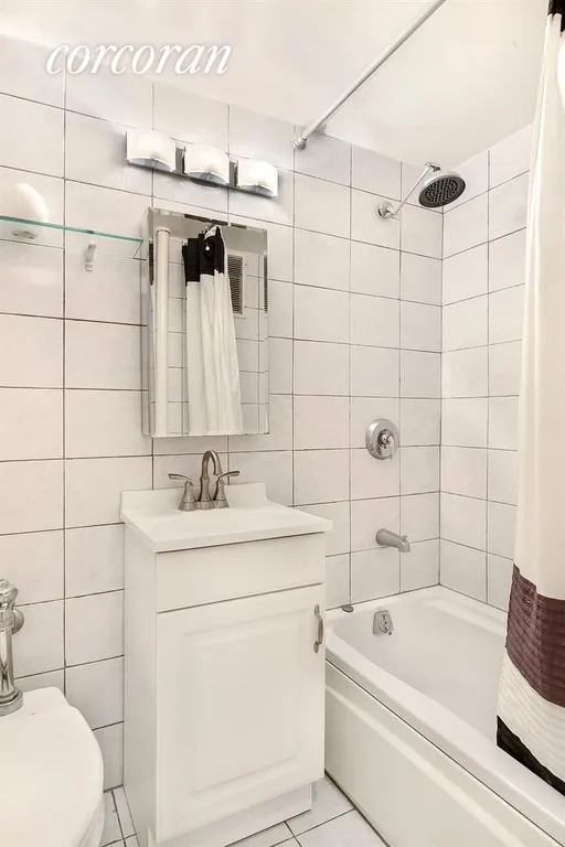 New York City Real Estate | View 20 Jane Street, 3A | Spotless ceramic tiled bath. Tub with rain shower. | View 4