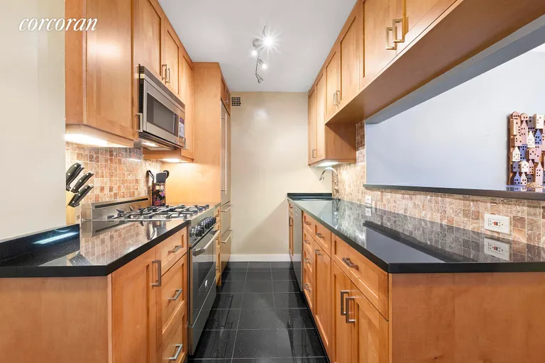 New York City Real Estate | View 235 East 57th Street, 2E | Renovated kitchen with top of the line appliances | View 2