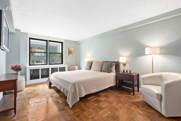 New York City Real Estate | View 235 East 57th Street, 2E | Master bedroom w/ en-suite bathroom | View 4