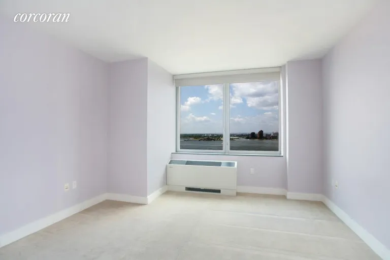 New York City Real Estate | View 30 West Street, 16G | Master Bedroom with River Views | View 3