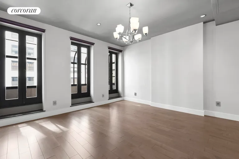 New York City Real Estate | View 310 East 69th Street | Bedroom with oversize windows & Julliet balcony. | View 6