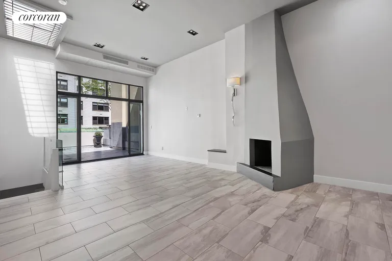 New York City Real Estate | View 310 East 69th Street | Top-floor living area and outdoor space. | View 7
