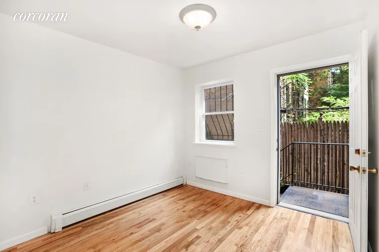New York City Real Estate | View 477 Classon Avenue, 1A | Bedroom 1 with access to Private backyard Patio | View 4