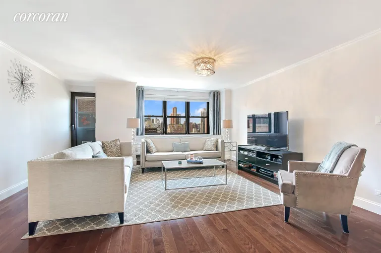 New York City Real Estate | View 340 East 80th Street, PHV | Living Room with western views and door to terrace | View 2
