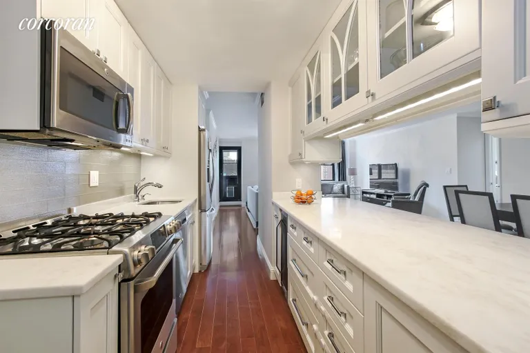 New York City Real Estate | View 340 East 80th Street, PHV | New Kitchen with wine cooler and w/d | View 4