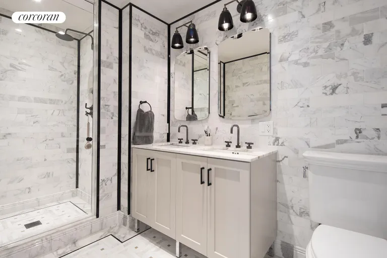 New York City Real Estate | View 265 State Street, 1013 | Marble clad ensuite master bathroom  | View 6