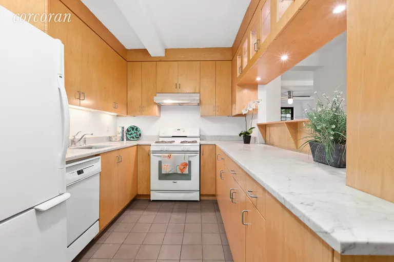 New York City Real Estate | View 102 East 22nd Street, 2AB | Open U-Shaped Kitchen with Marble Counters | View 4