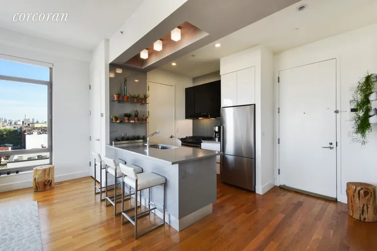 New York City Real Estate | View 315 Gates Avenue, 6S | Island kitchen with top of the line appliances | View 2