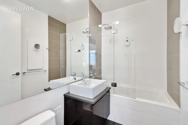 New York City Real Estate | View 315 Gates Avenue, 6S | Bathroom with radiant heated floors | View 5