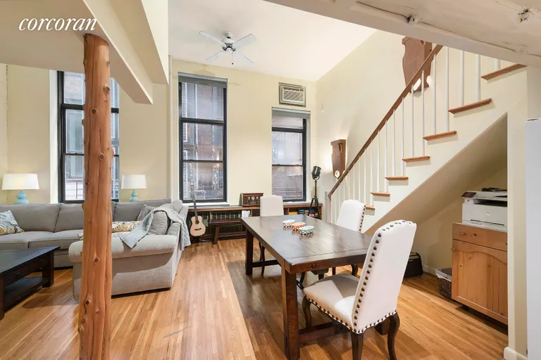 New York City Real Estate | View 43 East 10th Street, 2J | Great Room with Dining Area and Full Stair to Loft | View 2