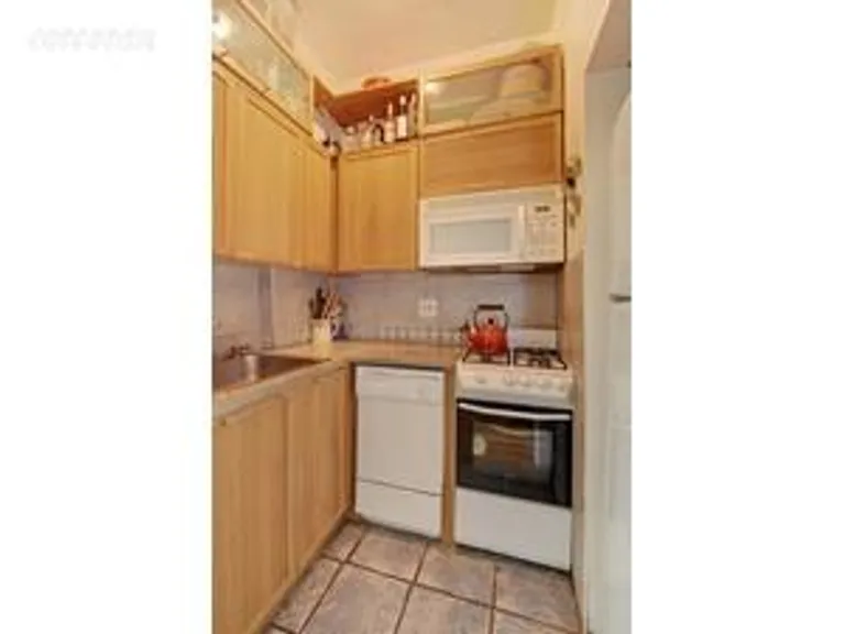New York City Real Estate | View 451 Clinton Avenue, 1E | Alcove kitchen with DW | View 3
