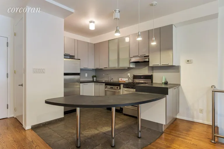 New York City Real Estate | View 392 14th Street, 1B | Stainless steel appliances and ample seating | View 2