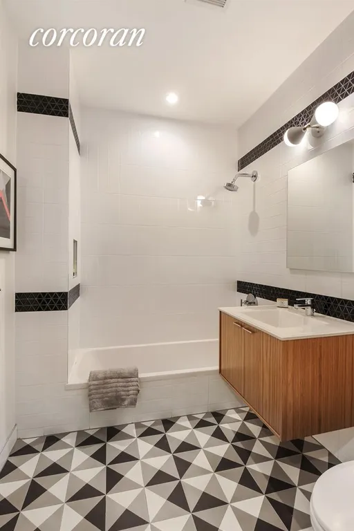 New York City Real Estate | View 755 Hart Street, 1 | Custom Bathroom with Cement Tiles | View 8