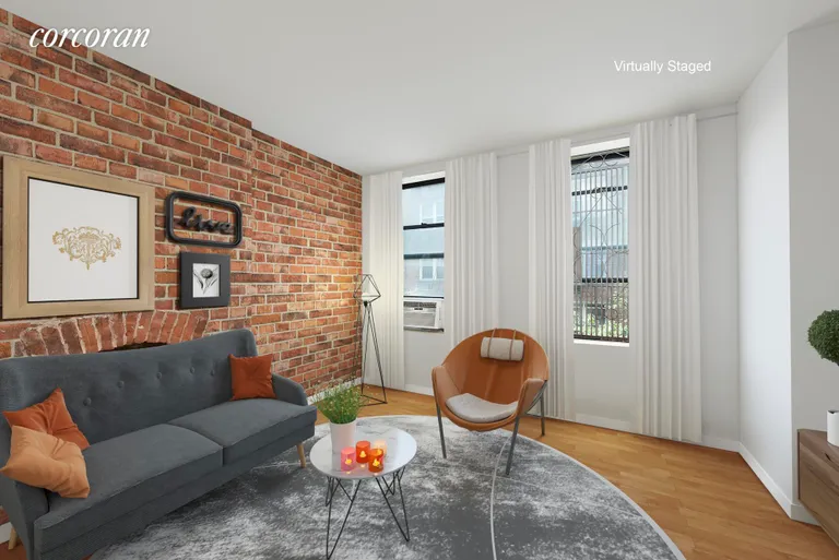 New York City Real Estate | View 220 East 82nd Street, 3RE | Cozy Living Room. Virtually Staged. | View 2