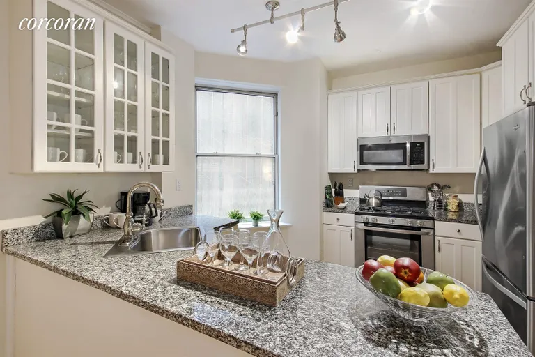 New York City Real Estate | View 140 West 71st Street, 5BC | Windowed Kitchen with D/W and breakfast bar | View 3
