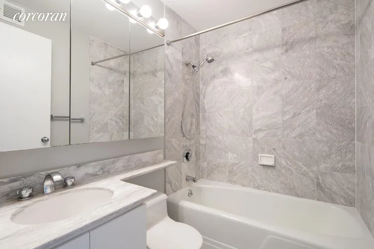 New York City Real Estate | View 275 Greenwich Street, 10A | One of two full marble bathrooms | View 7