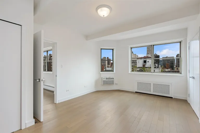 New York City Real Estate | View 20 East 68th Street, 16B | Bright Master Bedroom | View 3
