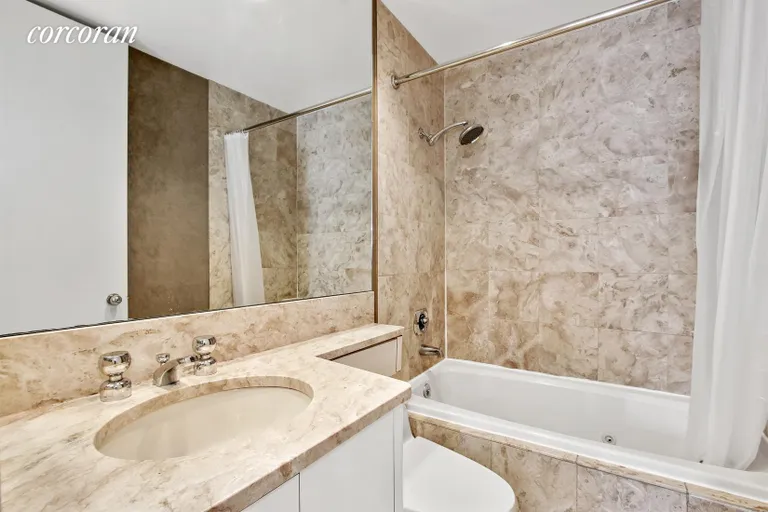 New York City Real Estate | View 100 United Nations Plaza, 15F | Marble Bathroom with Jacuzzi tub | View 4