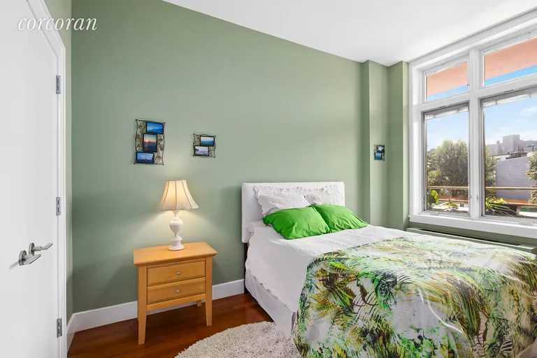 New York City Real Estate | View 12 McGuinness Blvd S, 2F | West-facing Bedroom with California Closets | View 2