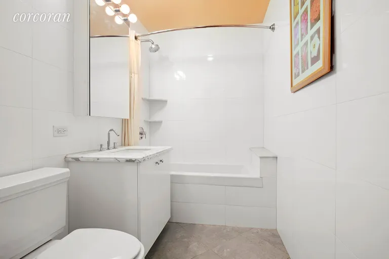 New York City Real Estate | View 12 McGuinness Blvd S, 2F | Impeccable Bathroom with Deep Soaking Tub | View 5