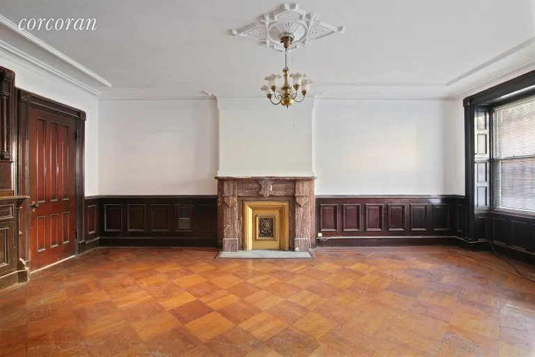 New York City Real Estate | View 86 Hancock Street | Wood Paneled Den with Shutters, Mantel & Moldings
 | View 2