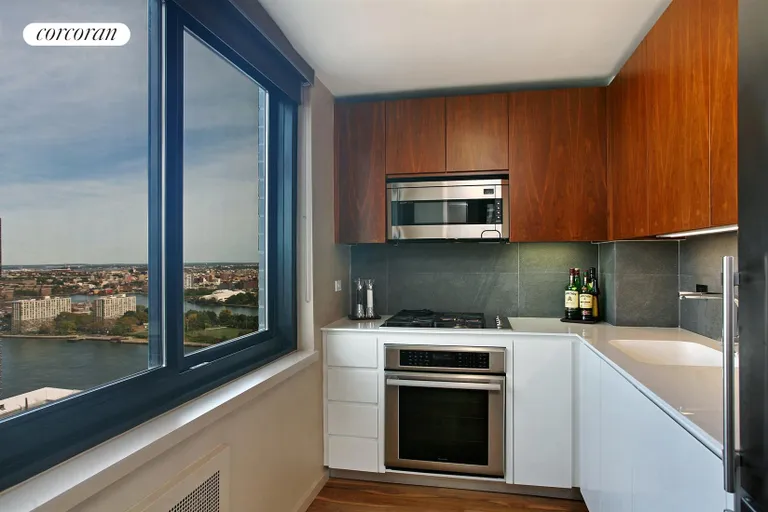 New York City Real Estate | View 515 East 72nd Street, 30H | Windowed Chef's Kitchen with a View | View 2