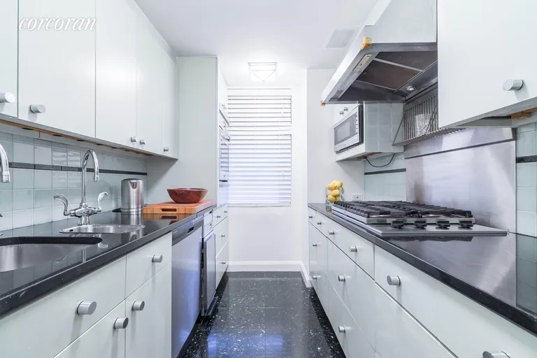 New York City Real Estate | View 20 Sutton Place South, 1C | Windowed Kitchen w/marble floors & walk-in-pantry | View 6