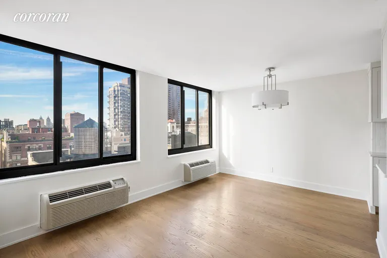 New York City Real Estate | View 115 East 87th Street, 18B | Windowed Dining Alcove Area with chandelier | View 4
