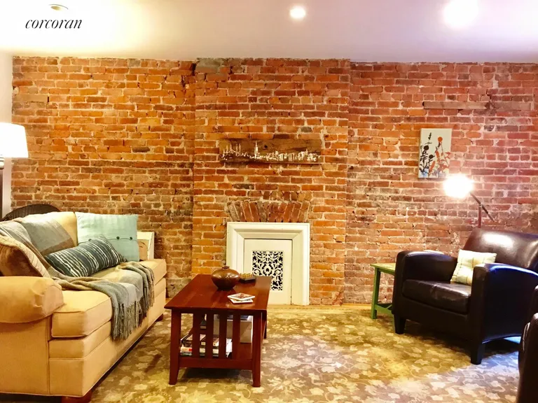 New York City Real Estate | View 434 6th Street, Garden | Exposed brick + decorative fireplace | View 3
