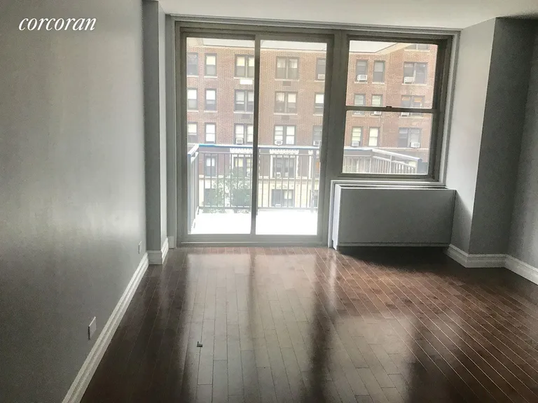 New York City Real Estate | View 301 East 79th Street, 4L | Living Room with Balcony | View 2