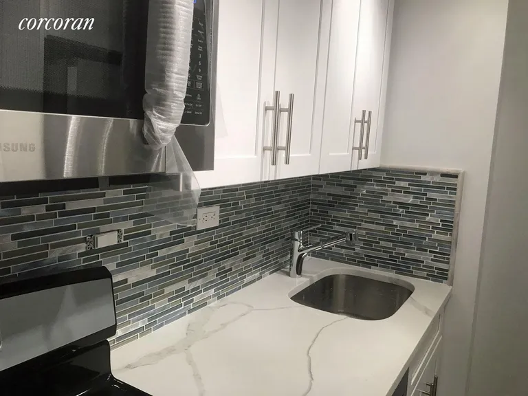 New York City Real Estate | View 301 East 79th Street, 4L | Granite Counters, new cabinets, tile backsplash  | View 4