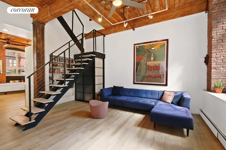New York City Real Estate | View 420 12th Street, J1R | Open loft living room with floating staircase | View 2