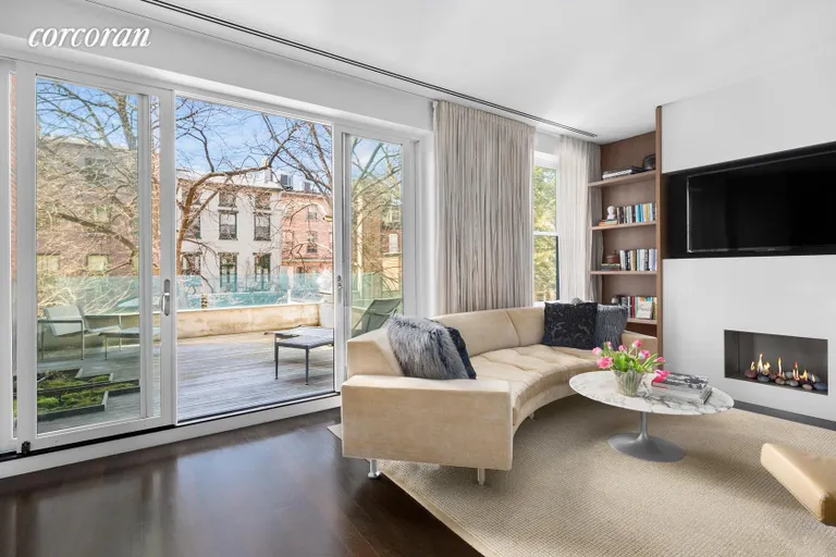 New York City Real Estate | View 16 Sidney Place | 3rd floor den with fireplace and terrace | View 7