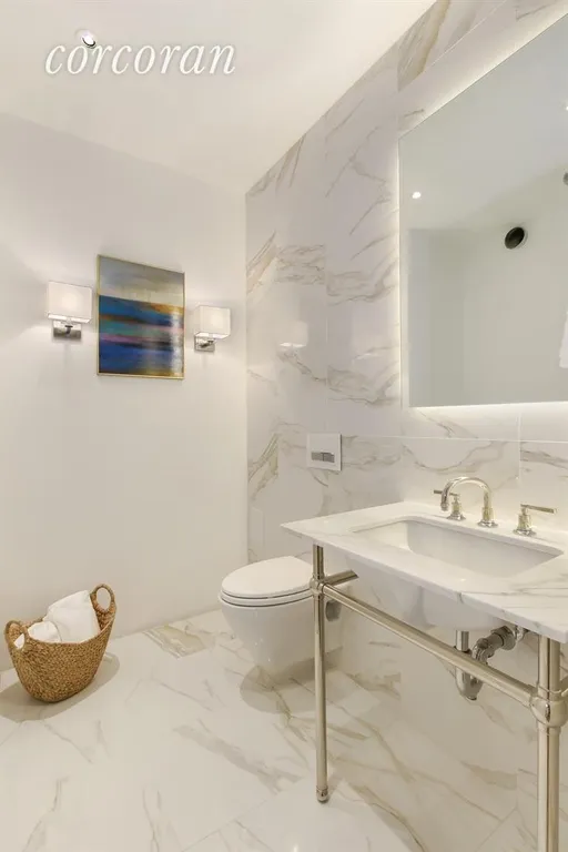 New York City Real Estate | View 60 East 8th Street, 33BC | Spacious Powder Room | View 9