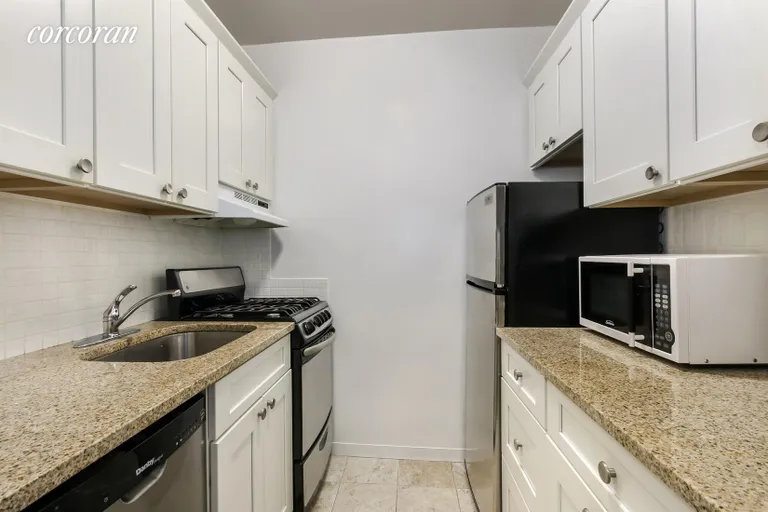 New York City Real Estate | View 2 Fifth Avenue, 2U | Renovated granite kitchen with stainless steel app | View 6