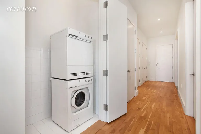 New York City Real Estate | View 360 Furman Street, 911 | Laundry Room in Unit And Hallway Lined W/ Closets | View 9