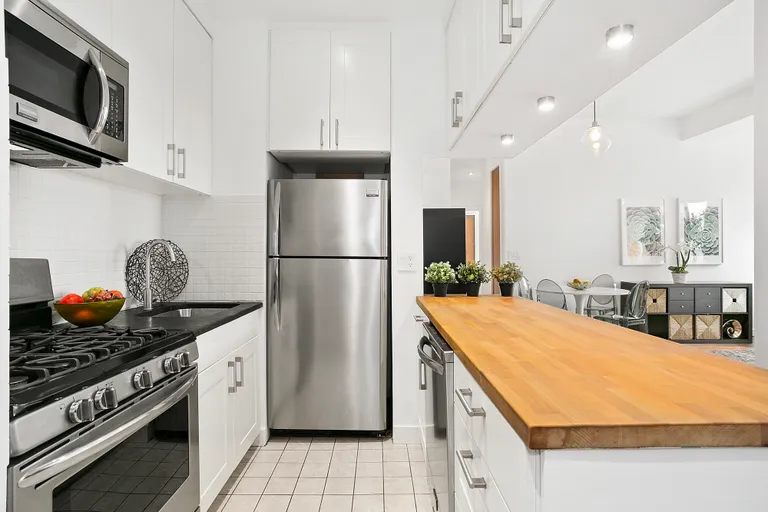 New York City Real Estate | View 150 Joralemon Street, 11B | Double Height Cabinets and Stainless Appliances | View 2