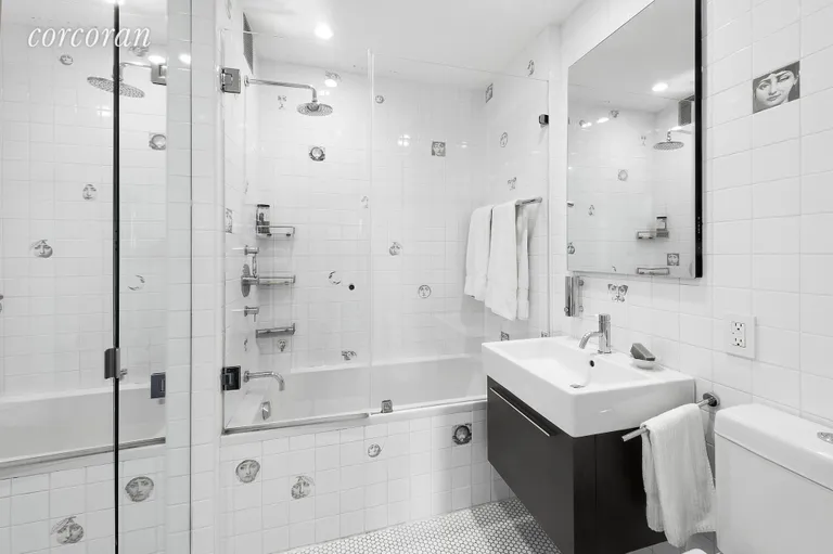 New York City Real Estate | View 1 Fifth Avenue, 15E | Unique Bathroom with silver Fornasetti tiles  | View 8