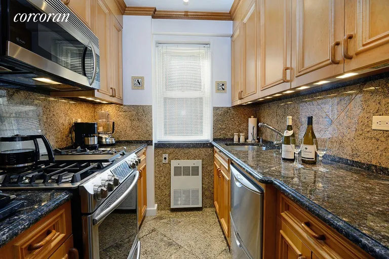 New York City Real Estate | View 30 East 65th Street, 9D | Windowed Kitchen | View 6