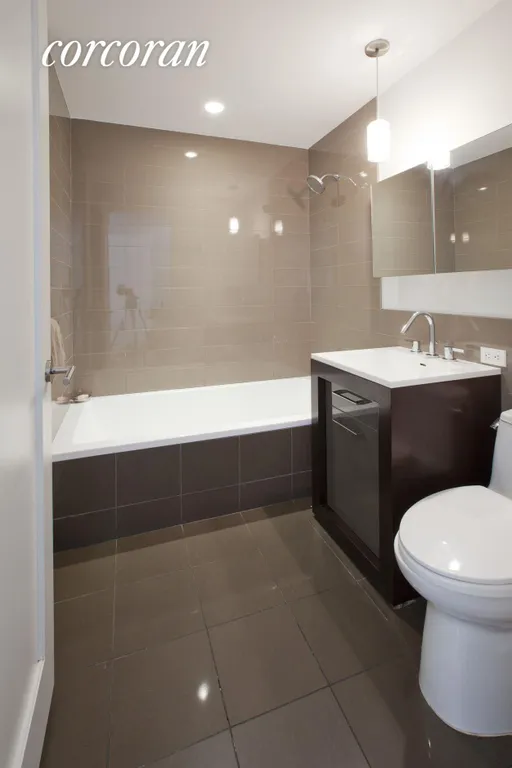 New York City Real Estate | View 125 North 10th Street, N2B | Mint Tiled Bathroom with Deep Soaking Tub | View 5