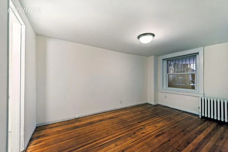 New York City Real Estate | View 115 State Street, 1 | King-size Bedroom with Huge Garden View Window | View 6