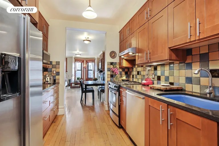 New York City Real Estate | View 719 Carroll Street, 3L | Pristine kitchen opens to the dining/ living areas | View 2