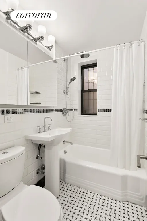 New York City Real Estate | View 30 East 9th Street, 5A | Renovated windowed bathroom. | View 5